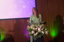 Claudia Hanna-Veysel, founder of Olive Oil Flights, at the 2026 CBIC Award Gala after accepting the Innovators Row People's Choice Award.