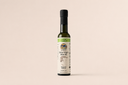 Full-sized bottle of premium Greek Chipotle Koroneiki extra virgin olive oil