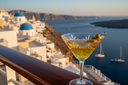 Olive oil in a martini glass overlooking Santorini
